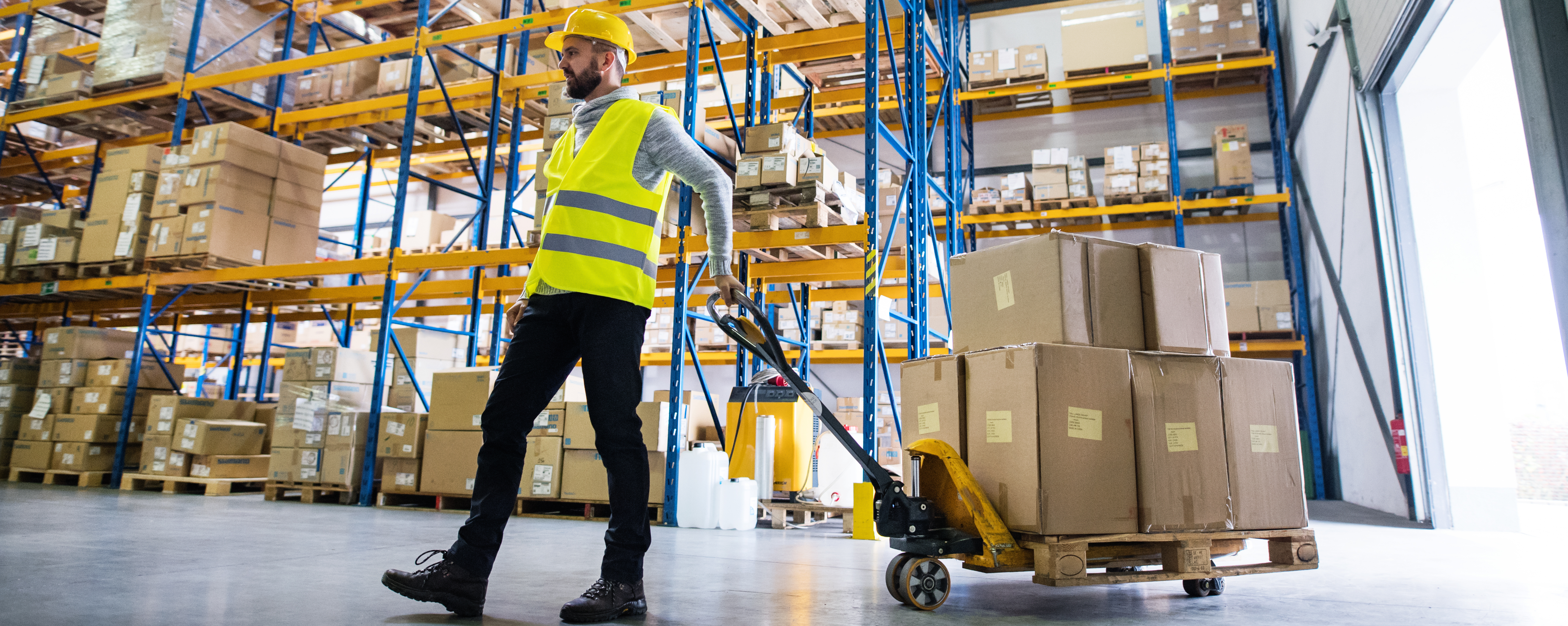 Warehouse Foreman moving a pallet of electrical equipment.