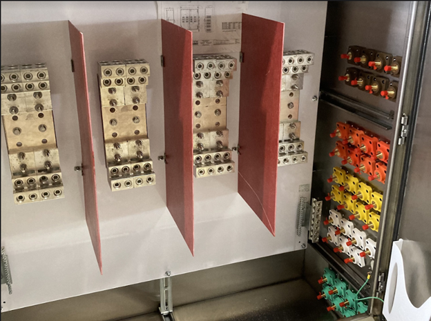 Custom 3200A, 277/480V Tap Box with pre-installed wire-to-source cable attachments, male cams, and cam lock panels that are color coded for easy identification