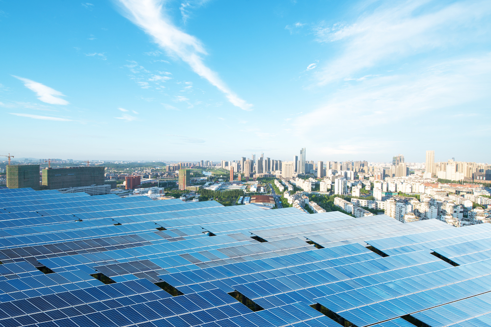 Solar farm in foreground and Los Angeles, California, in the background on a sunny day.